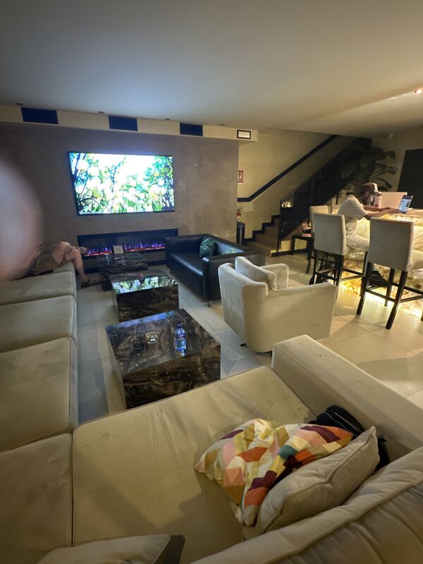 The staircase up to the second floor, beside the bar.